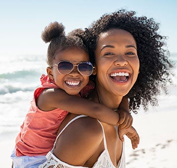 Mother and daughter smiling