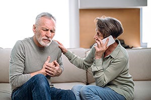 Man holding heart with woman on the phone