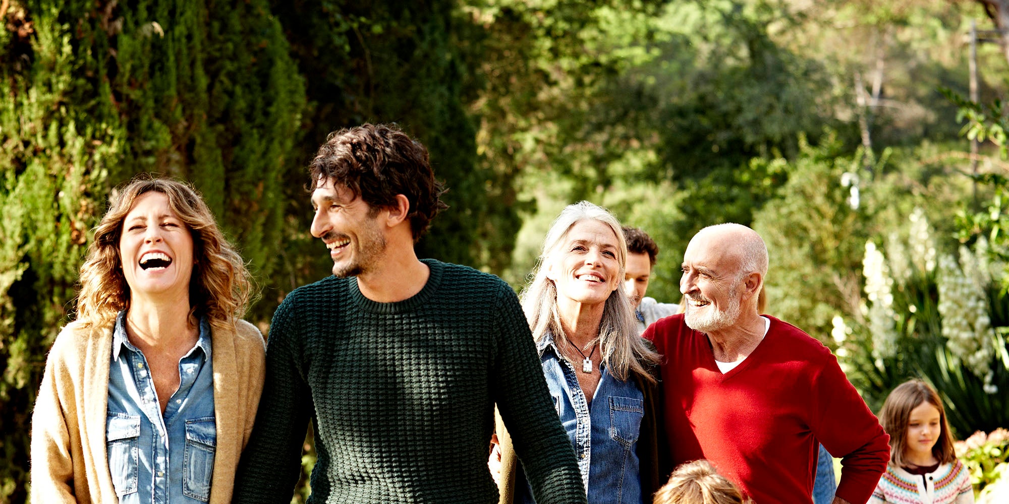 Family walking outside in the sun