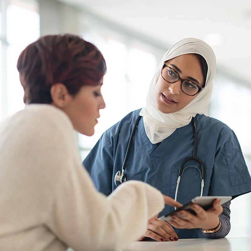 Woman talking to doctor