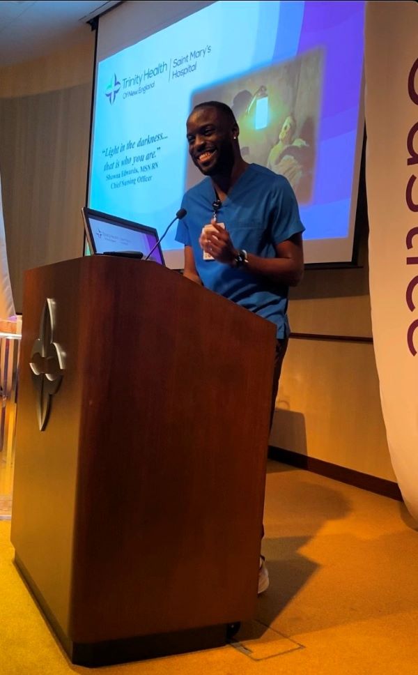 Nathan McCooty, RN delivers address