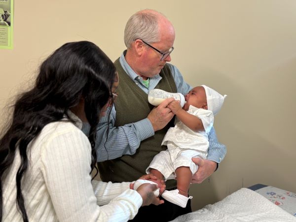 Dr. Doolittle feeds Jrue while mom dresses him for the special occasion.