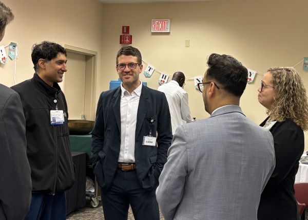 Leaders talking to Dr. Johar