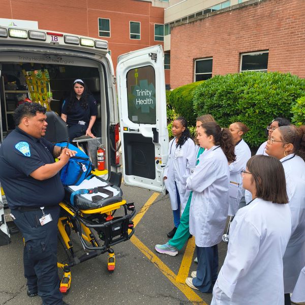 Students learn from EMT's.