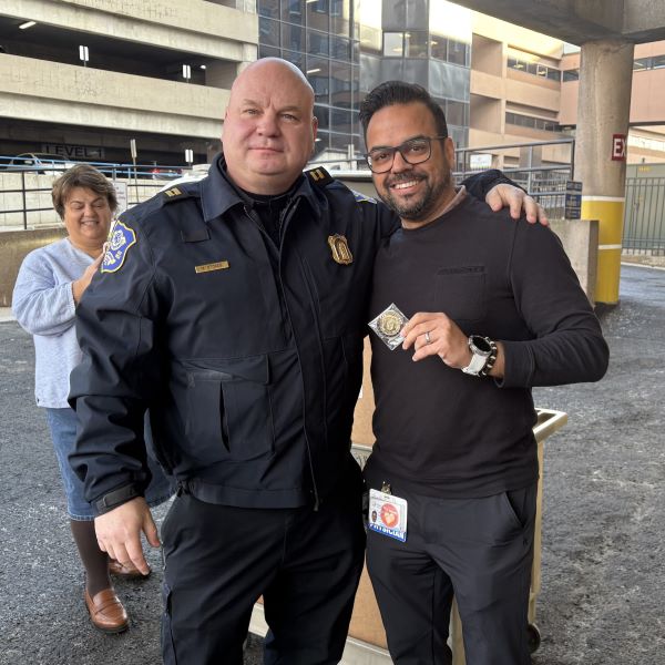 Captain Michael Stokes presents Dr. Husnain Kermalli, CMO the 165 Aniversary of the Waterbury Police Department Challenge Coin - Emergency Response Team and Hostage Negotiation Team Coin.
