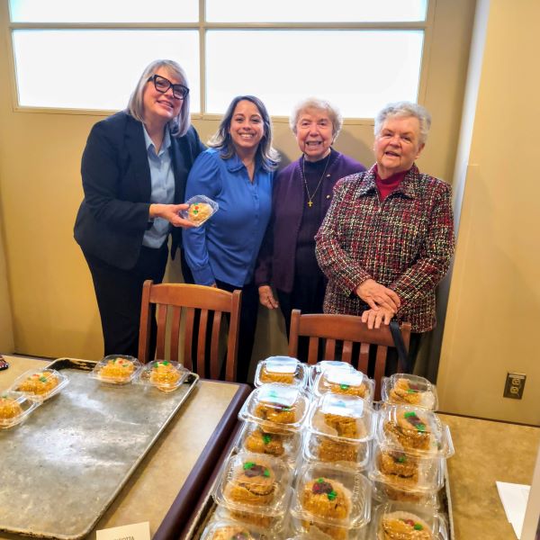 Sisters of Saint Joseph, Saint Mary's leadership and staff help distribute zeppoles