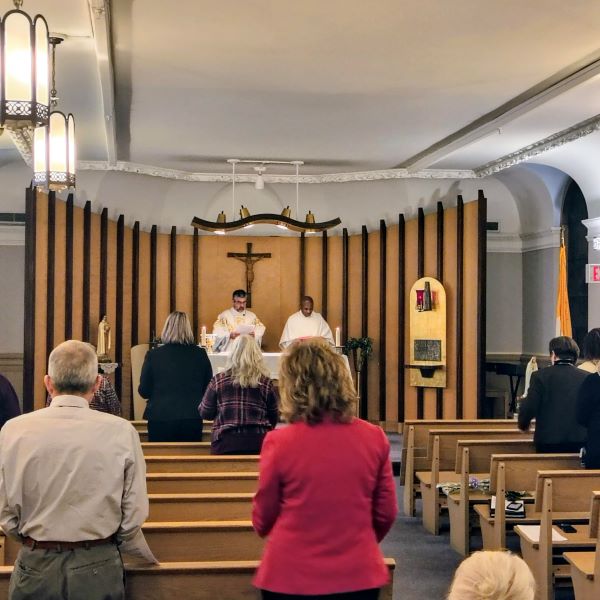 Saint Mary's colleagues attend the Feast of Saint Joseph Mass