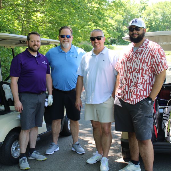 Golfers enjoy the 2026 golf invitational.