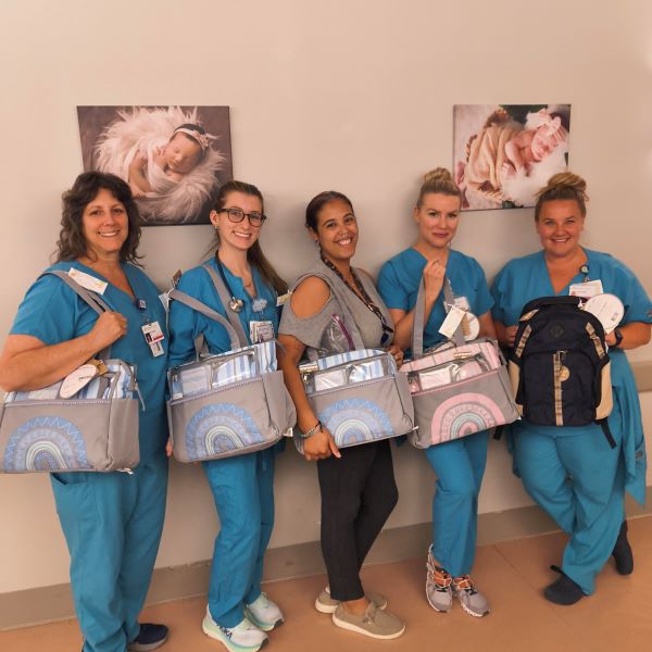 WIC team with donated diaper bags