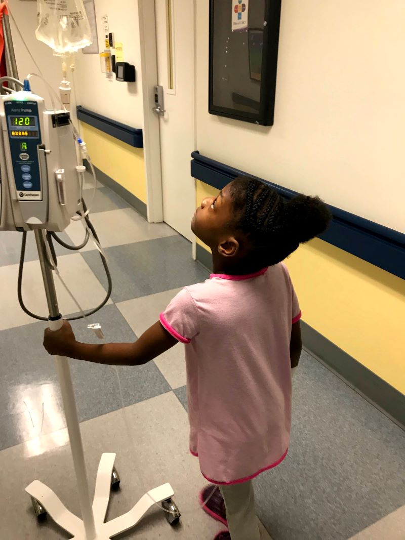 Little girl walking in hospital